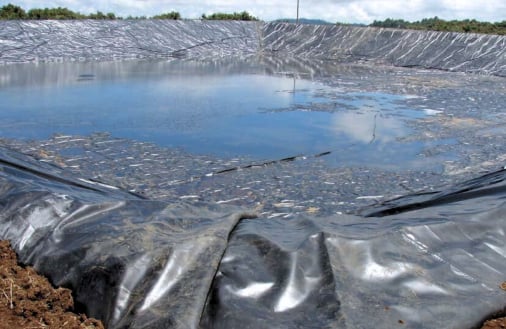 Damaged leaking PVC liner for an earth dam